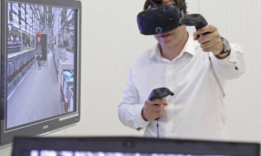Man wearing virtual reality headset and controllers, experiencing immersive virtual shopping environment