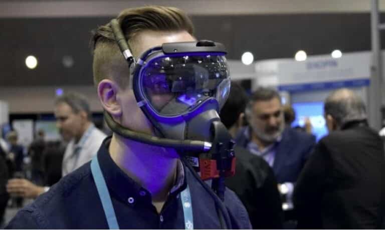 A man wearing a virtual reality headset at a tech conference