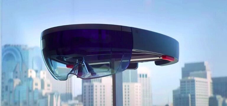 A futuristic-looking transportation pod suspended above a modern city skyline