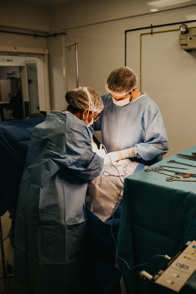 Two surgeons performing a medical procedure in an operating room