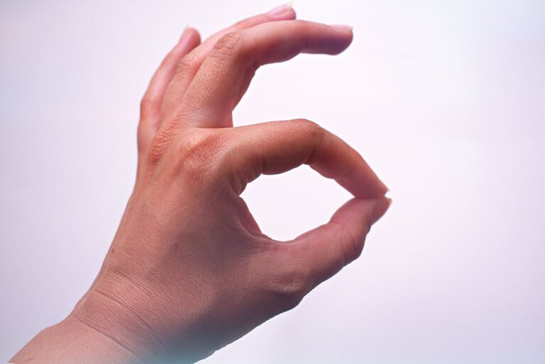 A hand making an okay gesture, representing positive approval or agreement