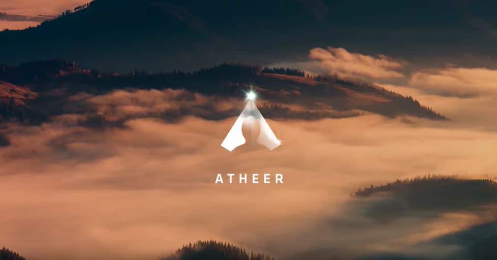 A scenic image of mountains shrouded in fog at sunset, with the Atheer logo in the center