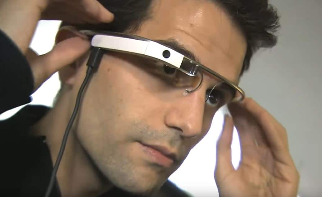 Person wearing smart glasses with built-in camera and display