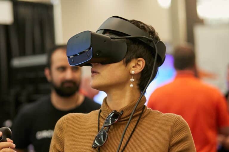 A person wearing a virtual reality headset, immersed in a digital experience.