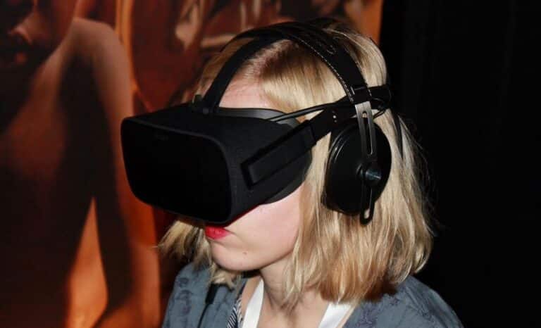 A person wearing a virtual reality headset and headphones, immersed in a digital experience.