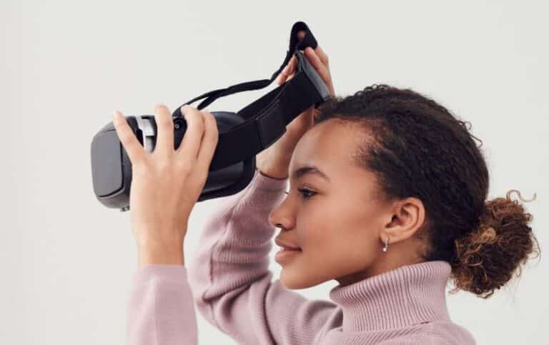 A woman wearing virtual reality headset, exploring immersive digital experiences