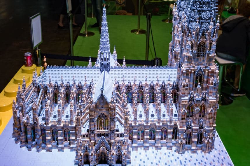 Detailed Lego model of a grand cathedral with intricate architectural details and sculptures