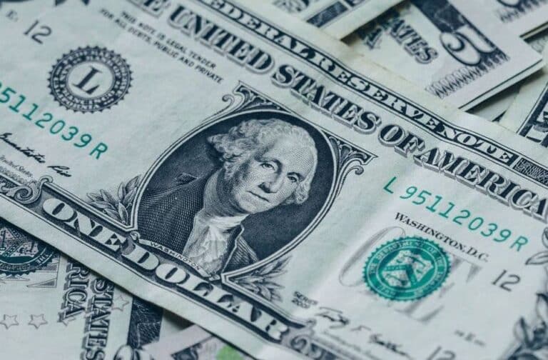 Close-up of one-dollar bills with the portrait of George Washington