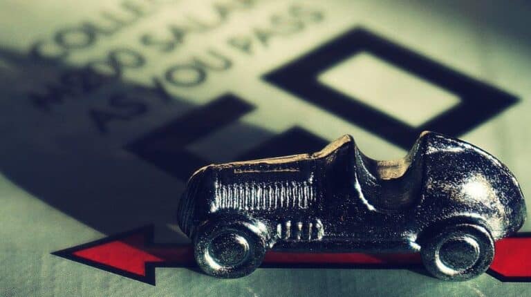A vintage toy car on a background with the words 'Long way home'