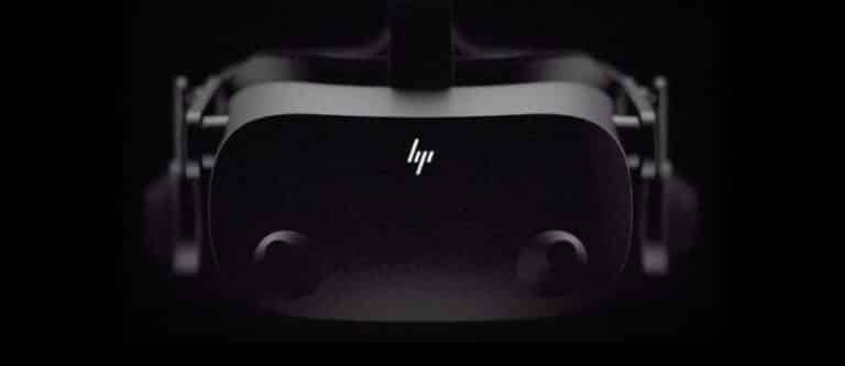 Black and white image of a virtual reality headset, likely an HP VR device, against a dark background