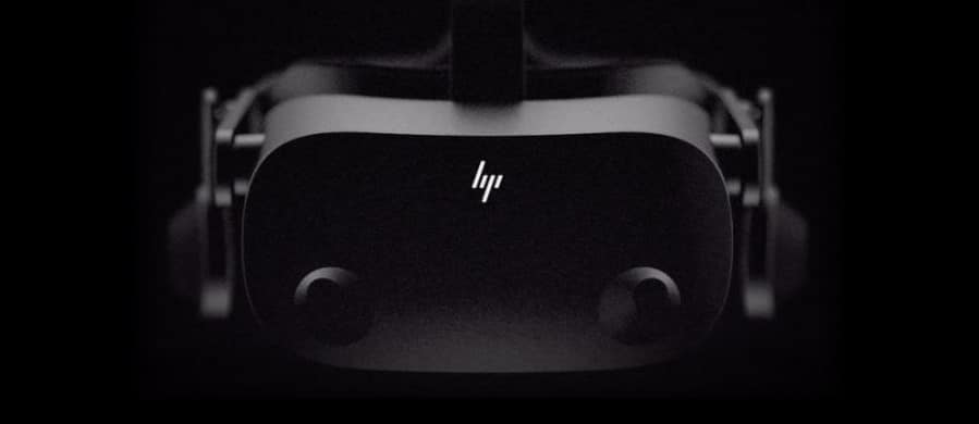 Black and white image of a virtual reality headset, likely an HP VR device, against a dark background