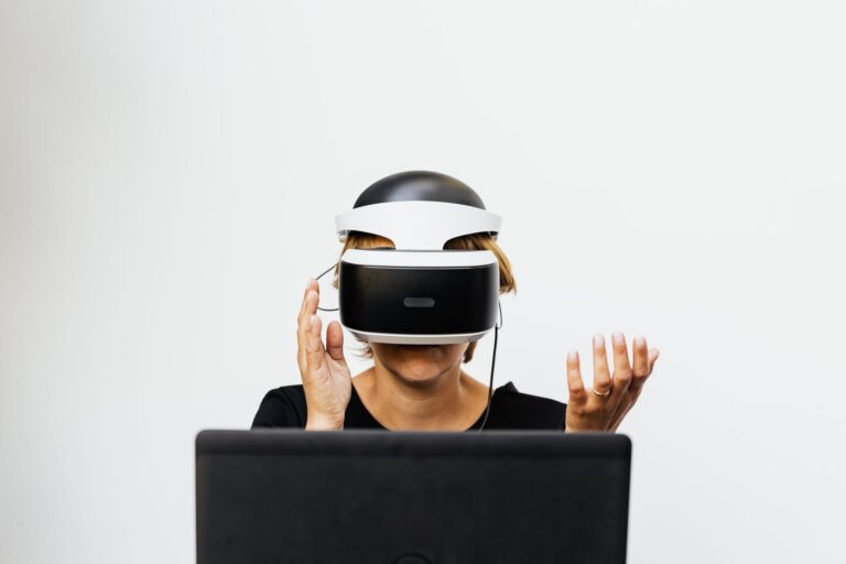 Woman wearing a virtual reality headset, interacting with a virtual environment