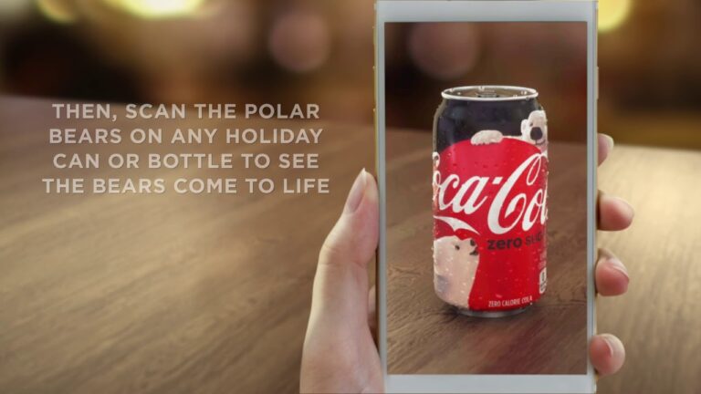A hand holding a can of Coca-Cola Zero Sugar with an image of polar bears on the can