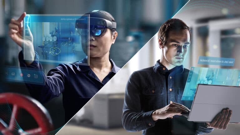 Two men working with futuristic technology, one using a virtual reality headset and the other using a laptop computer