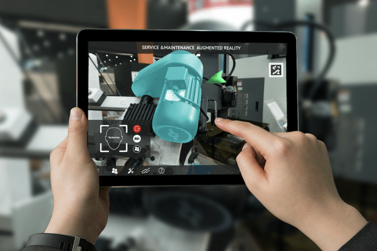 Hands holding a tablet displaying an augmented reality view of a service and maintenance machine with interactive icons