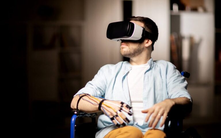 A man in a wheelchair wearing a virtual reality headset, immersed in a digital experience