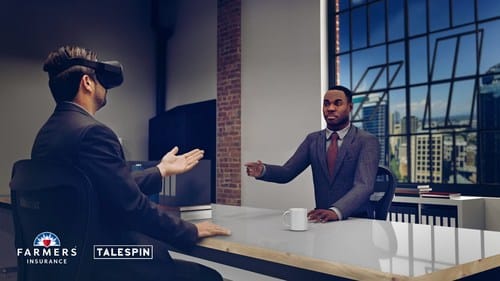 Two businessmen engaged in a virtual reality presentation, with one wearing a VR headset and the other gesturing at a screen.