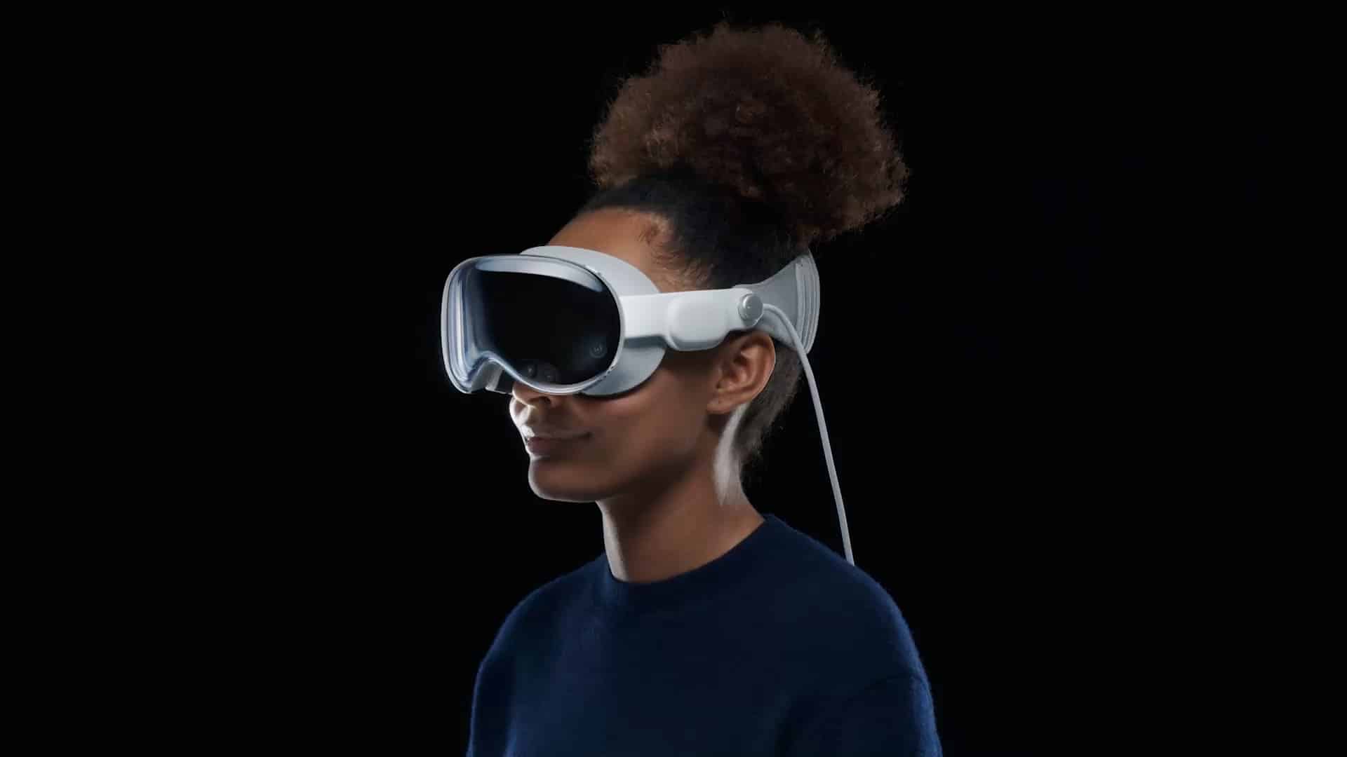 Person wearing virtual reality headset on a black background