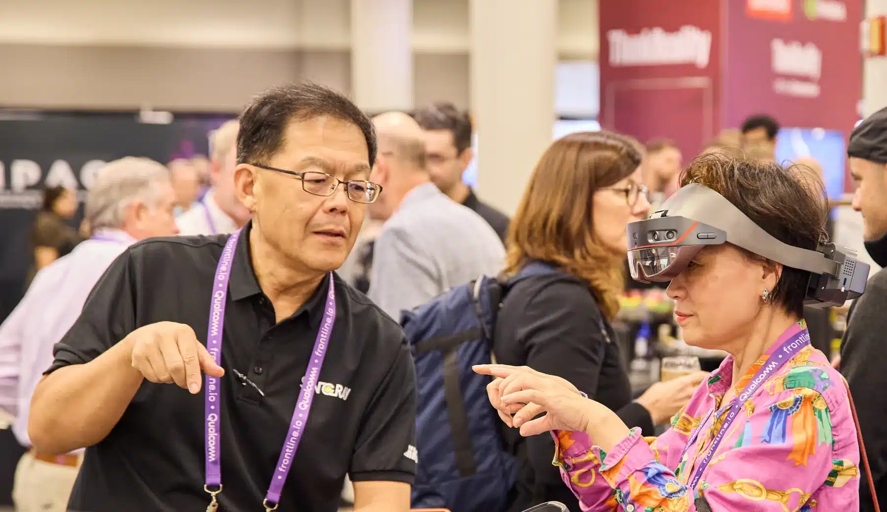 Attendees trying mixed reality headsets on the expo floor